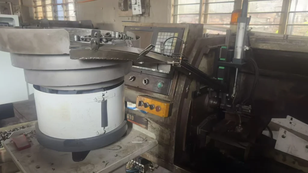 Automation in Carbon Steel Fittings: Truss Robots vs. Vibratory Feeders